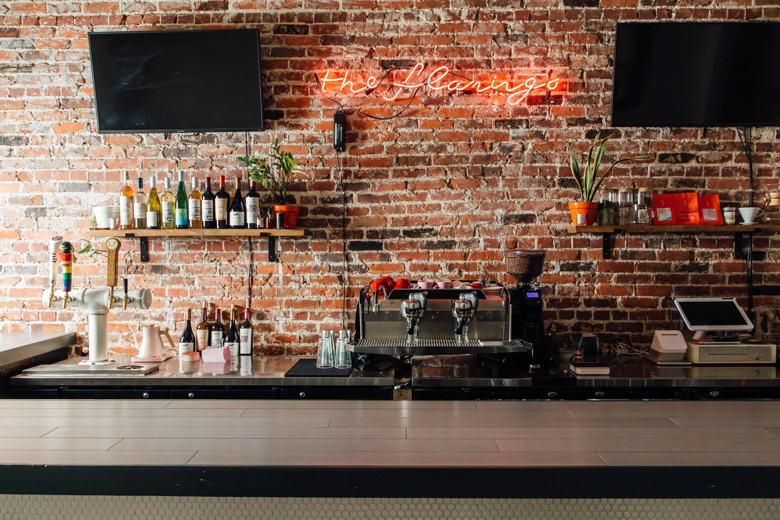 Coffee bar and neon sign at Flamingo Coffee in Murray Hill